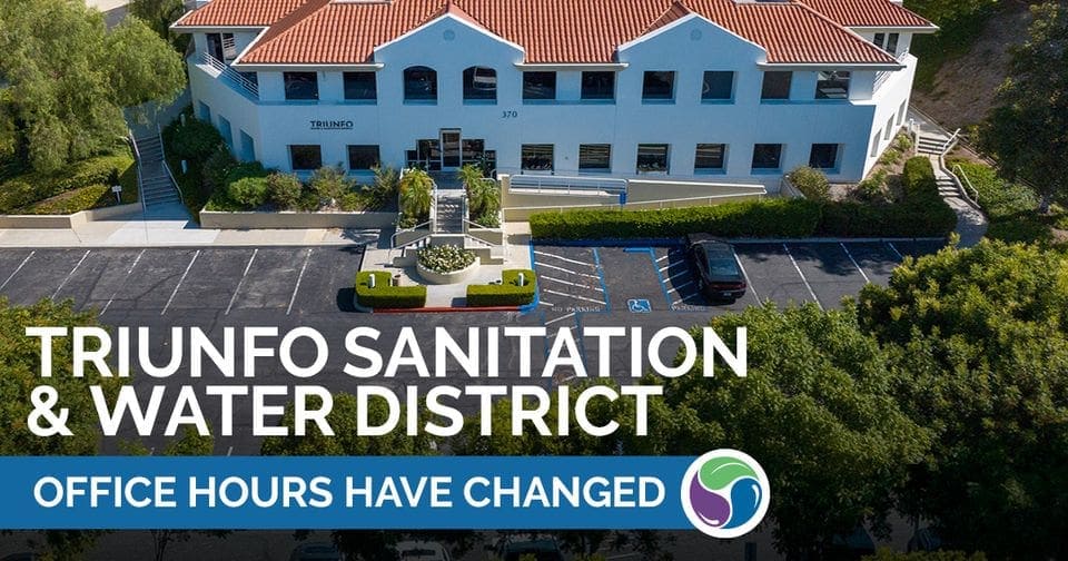 Aerial view of Triunfo Water & Sanitation District office building with updated service hours announ.