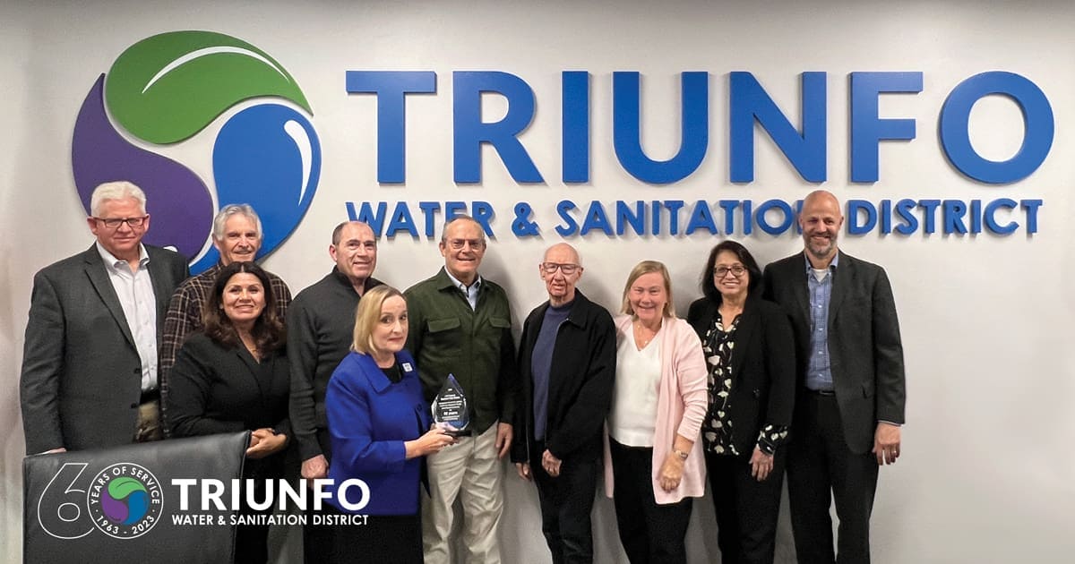 Triunfo_60thAward_SocialGraphic Triunfo Water & Sanitation District team at 2023 Year in Review event, smiling.